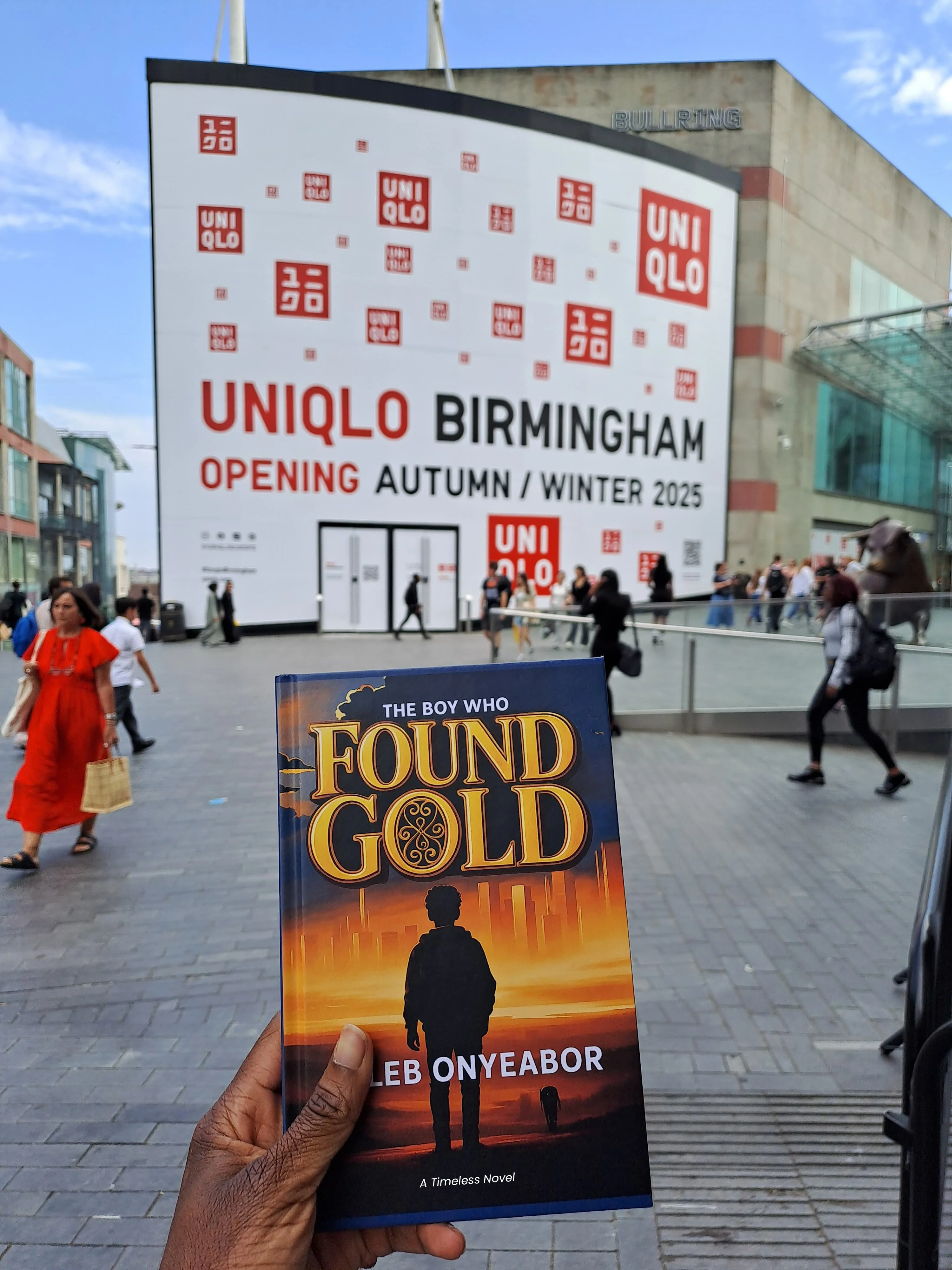 Reader with The Boy Who Found Gold novel by Caleb Onyeabor in Birmingham, United Kingdom - timeless story of hope and ambition